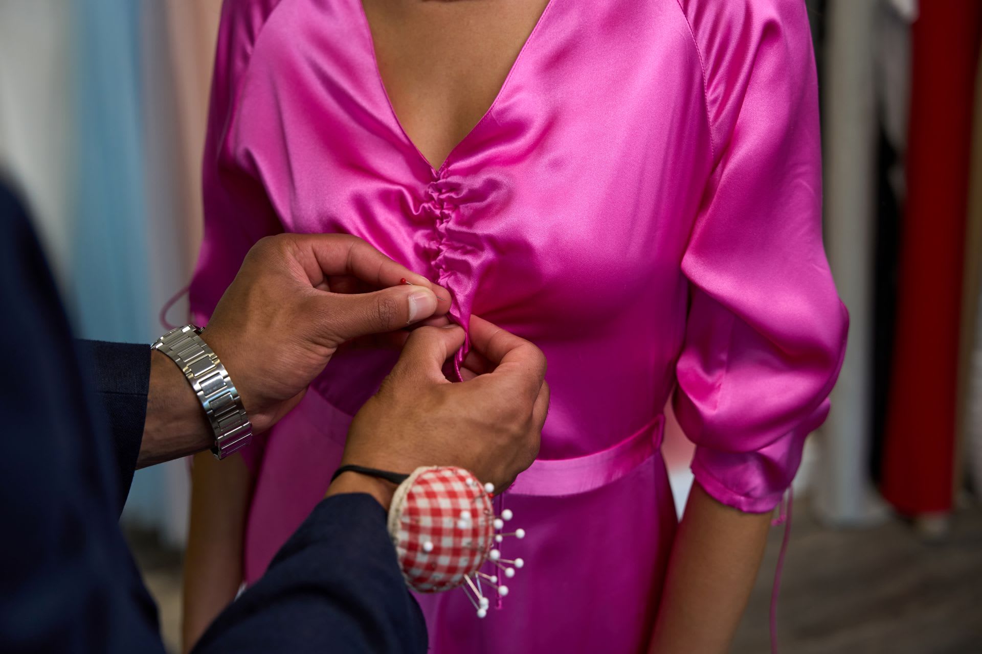 Man fixing a revealing neckline at a fancy event. Women's Wardrobe Malfunctions